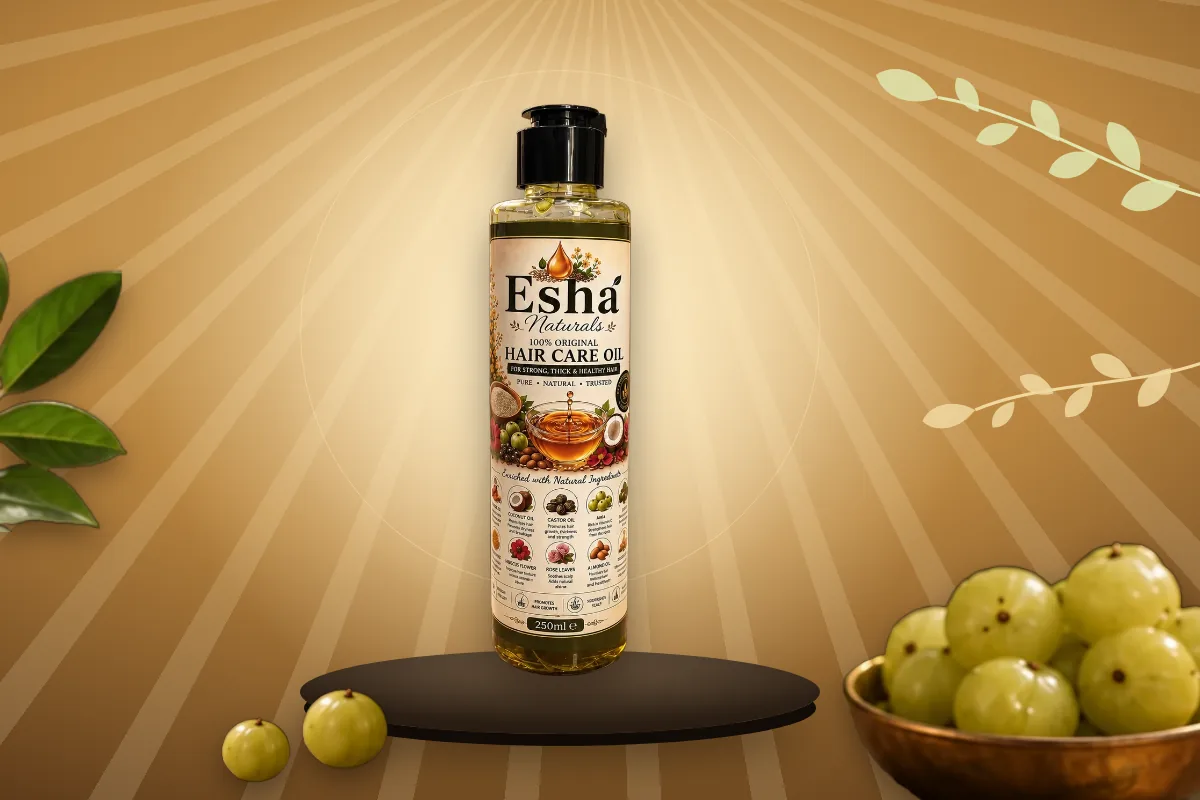Esha Naturals Hair Care Oil with a bowl of fresh amla and leaves